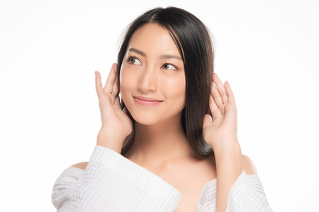 Beautiful Young asian Woman with Clean Fresh Skin look. Girl beauty face care. Facial treatment. Cosmetology, beauty and spa.の写真素材