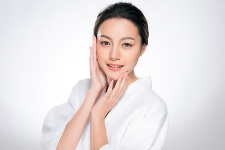 Beautiful Young asian Woman with Clean Fresh Skin look. Girl beauty face care. Facial treatment. Cosmetology, beauty and spa.の写真素材