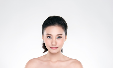 Beautiful Young asian Woman with Clean Fresh Skin look. Girl beauty face care. Facial treatment. Cosmetology, beauty and spa.の写真素材