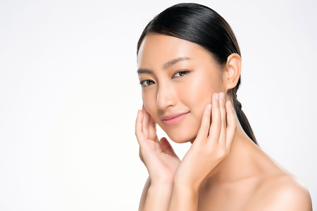 Beautiful Young Woman with Clean Fresh Skin. Face care . Facial treatment . Cosmetology , beauty and spa. Asian women portraitの写真素材