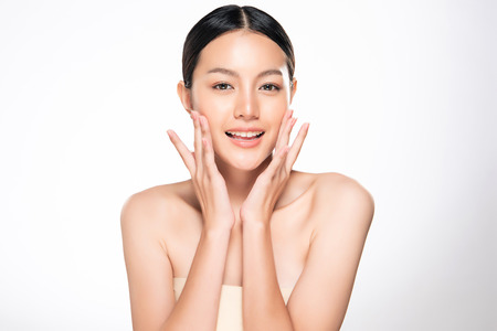 Beautiful Young Woman with Clean Fresh Skin touch own face, Facial treatment, Cosmetology, beauty and spa,の写真素材