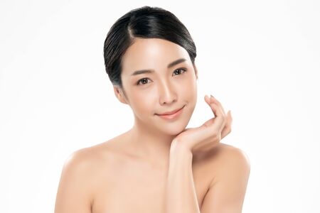 Beautiful Young Asian Woman with Clean Fresh Skin touch own face, Facial treatment, Cosmetology, beauty and spa,の写真素材