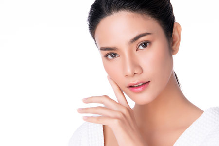 Beautiful Young Asian Woman with Clean Fresh Skin is touching her face, Facial treatment, Cosmetology, beauty and spa,の写真素材