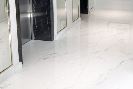 White marble floor in front of the elevator.の写真素材