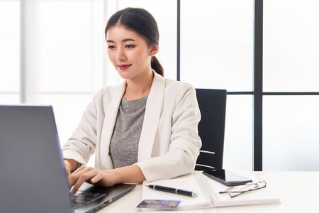 Asian working woman is working on her labtop. Working from home.の写真素材