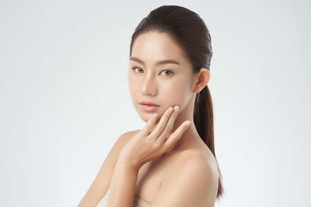 Beautiful Young asian Woman with Clean Fresh Skin, Face care, Facial treatment. Cosmetology, beauty and spa. Asian women portraitの写真素材