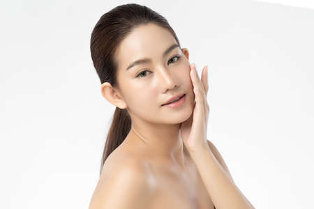 Beautiful Young asian Woman with Clean Fresh Skin, on white background, Face care, Facial treatment, Cosmetology, beauty and spa, Asian women portraitの写真素材