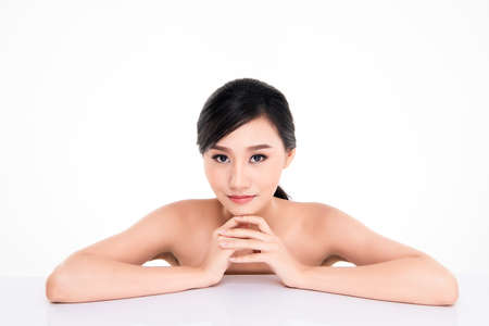 Beautiful Young asian Woman with Clean Fresh Skin, on white background, Face care, Facial treatment, Cosmetology, beauty and spa, Asian women portraitの写真素材