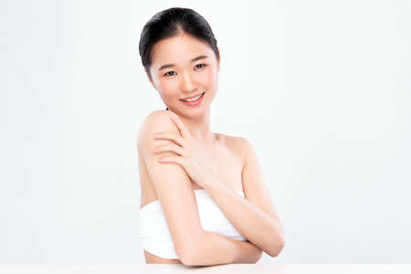 Beautiful Young asian Woman with Clean Fresh Skin, on white background, Face care, Facial treatment. Cosmetology, beauty and spa. Asian women portraitの写真素材