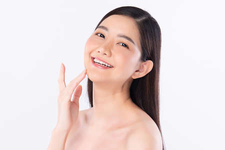 Beautiful Young asian Woman with Clean Fresh Skin, on white background, Face care, Facial treatment. Cosmetology, beauty and spa. Asian women portraitの写真素材