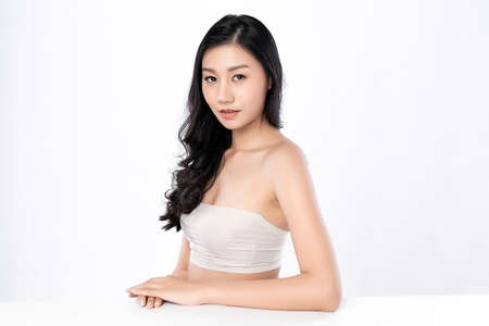 Beautiful Young asian Woman with Clean Fresh Skin, on white background, Face care, Facial treatment. Cosmetology, beauty and spa. Asian women portraitの写真素材