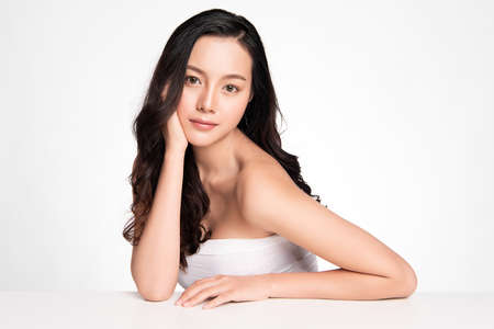 Beautiful Young asian Woman with Clean Fresh Skin, on white background, Face care, Facial treatment. Cosmetology, beauty and spa. Asian women portraitの写真素材