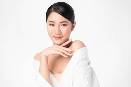 Beautiful young asian woman with clean fresh skin on white background, Face care, Facial treatment, Cosmetology, beauty and spa, Asian women portraitの写真素材