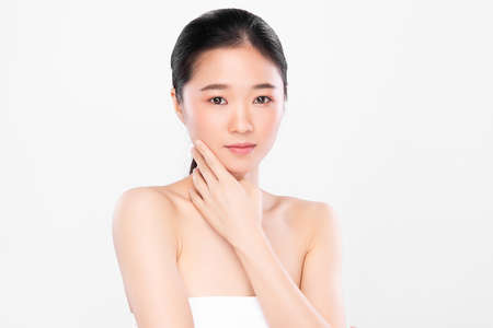 Beautiful young asian woman with clean fresh skin on white background, Face care, Facial treatment, Cosmetology, beauty and spa, Asian women portraitの写真素材
