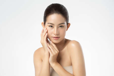 Beautiful young asian woman with clean fresh skin on white background, Face care, Facial treatment, Cosmetology, beauty and spa, Asian women portraitの写真素材