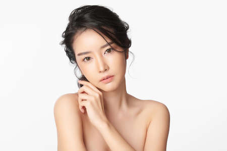 Beautiful young asian woman with clean fresh skin on white background, Face care, Facial treatment, Cosmetology, beauty and spa, Asian women portraitの写真素材