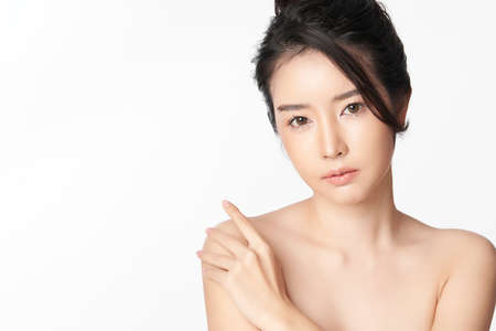 Beautiful young asian woman with clean fresh skin on white background, Face care, Facial treatment, Cosmetology, beauty and spa, Asian women portraitの写真素材