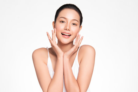Beautiful young asian woman with clean fresh skin on white background, Face care, Facial treatment, Cosmetology, beauty and spa, Asian women portraitの写真素材