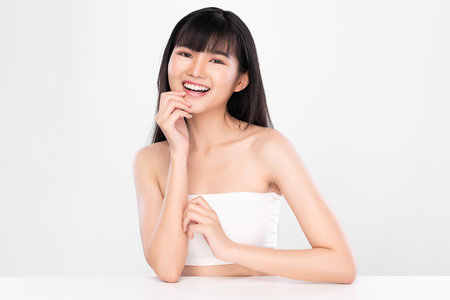 Beautiful young asian woman with clean fresh skin on white background, Face care, Facial treatment, Cosmetology, beauty and spa, Asian women portraitの写真素材