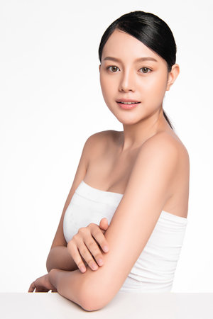 Beautiful young asian woman with clean fresh skin on white background, Face care, Facial treatment, Cosmetology, beauty and spa, Asian women portraitの写真素材