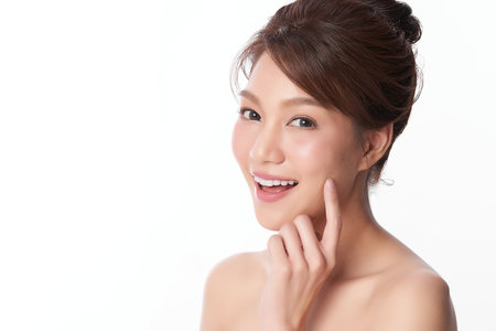 Beautiful young asian woman with clean fresh skin on white background, Face care, Facial treatment, Cosmetology, beauty and spa, Asian women portraitの写真素材