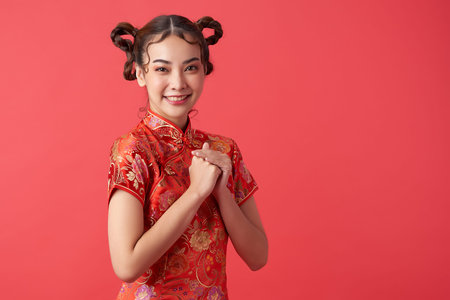 Asian chinese woman in traditional dress on red background. Chinese new year festival
