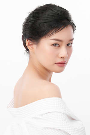 Beautiful young asian woman with clean fresh skin on white background, Face care, Facial treatment, Cosmetology, beauty and spa, Asian women portraitの写真素材