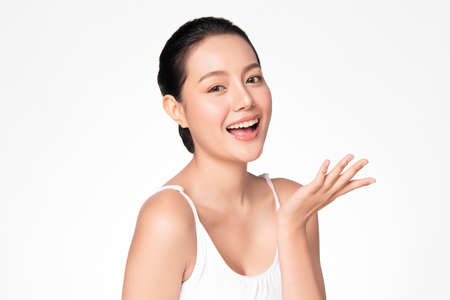 Beautiful young asian woman with clean fresh skin on white background, Face care, Facial treatment, Cosmetology, beauty and spa, Asian women portraitの写真素材