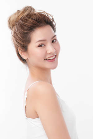 Beautiful young asian woman with clean fresh skin on white background, Face care, Facial treatment, Cosmetology, beauty and spa, Asian women portrait.の写真素材
