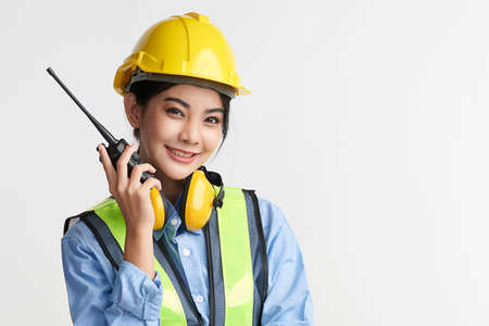 beautiful asian woman engineer and safety helmet on white background, construction concept, Engineer, Industry.の写真素材