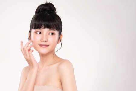 Beautiful young asian woman with clean fresh skin on white background, Face care, Facial treatment, Cosmetology, beauty and spa, Asian women portrait.の写真素材