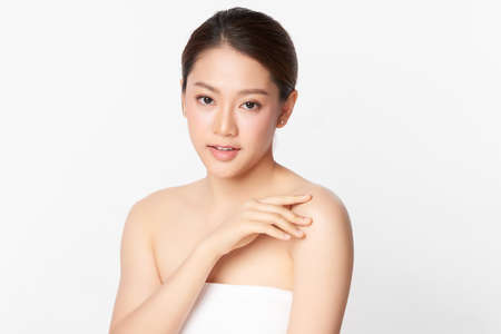 Beautiful young asian woman with clean fresh skin on white background, Face care, Facial treatment, Cosmetology, beauty and spa, Asian women portrait.の写真素材