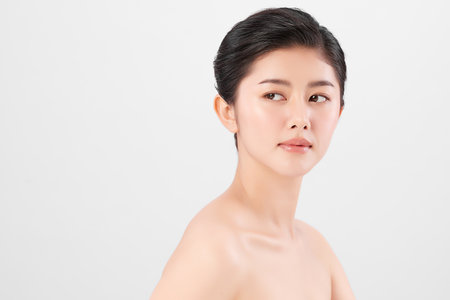 Beautiful young asian woman with clean fresh skin on white background, Face care, Facial treatment, Cosmetology, beauty and spa, Asian women portrait.の写真素材