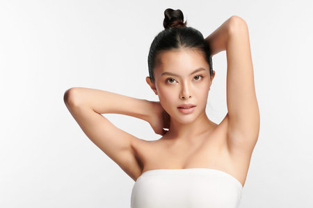 Beautiful young asian woman with clean fresh skin on white background, Face care, Facial treatment, Cosmetology, beauty and spa, Asian women portrait.の写真素材