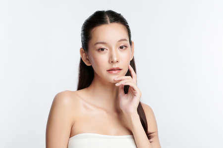 Beautiful young asian woman with clean fresh skin on white background, Face care, Facial treatment, Cosmetology, beauty and spa, Asian women portrait.の写真素材