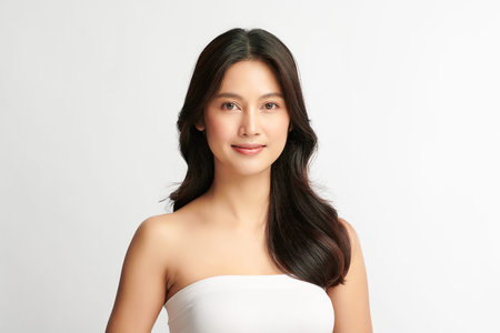 Beautiful young asian woman with clean fresh skin on white background, Face care, Facial treatment,...