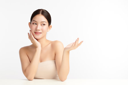 Beautiful young asian woman with clean fresh skin on white background, Face care, Facial treatment, Cosmetology, beauty and spa, Asian women portrait.の写真素材