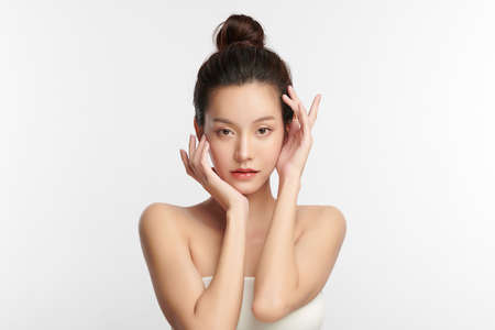 Beautiful young asian woman with clean fresh skin on white background, Face care, Facial treatment, Cosmetology, beauty and spa, Asian women portrait.の写真素材