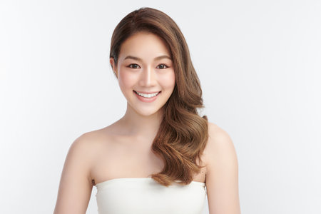 Beautiful young asian woman with clean fresh skin on white background, Face care, Facial treatment, Cosmetology, beauty and spa, Asian women portrait.の写真素材