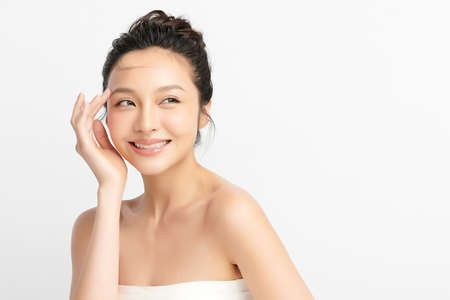 Beautiful young asian woman with clean fresh skin on white background, Face care, Facial treatment, Cosmetology, beauty and spa, Asian women portrait.の写真素材