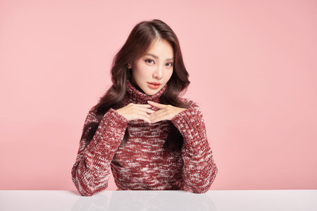 Beautiful young asian woman with clean fresh skin on pink background, Face care, Facial treatment, Cosmetology, beauty and spa, Asian women portrait.の写真素材