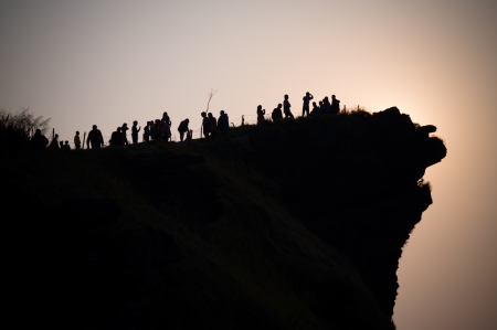 Silhouette of people on the cliff  Phu Chee Fah Thailand の写真素材