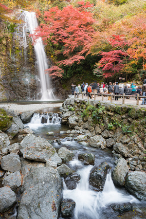 OSAKA, JAPAN -NOVEMBER 26, 2013: Mino waterfall full of tourists take photo in Autumn season Red Maple Leaf Fall Foliage, Minoo (Minoh or Mino) it is one of the best places in the Kansai, Osaka prefecture, Japanのeditorial素材