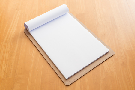 Wooden clipboard on wood backgroundの写真素材