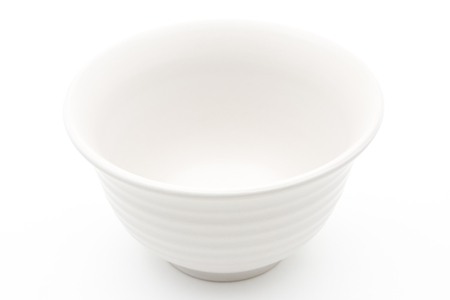 Empty white bowl on white backgroundの写真素材