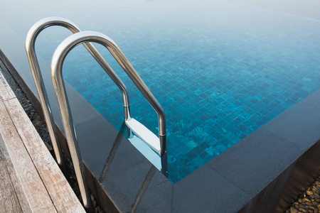 swimming pool with sunny reflectionsの写真素材