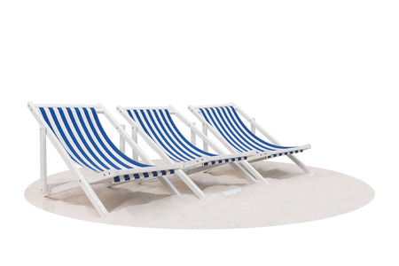 Three blue and white striped beach chair on the sand beach isolated on white backgroundの写真素材