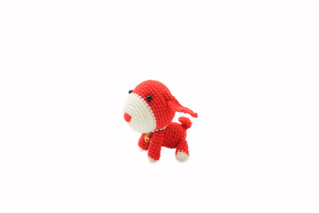 handmade crochet dog doll on white backgroundの写真素材