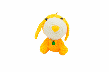 handmade crochet dog doll on white backgroundの写真素材