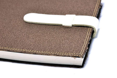 A slightly scuffed book cover with a linen textured binding の写真素材